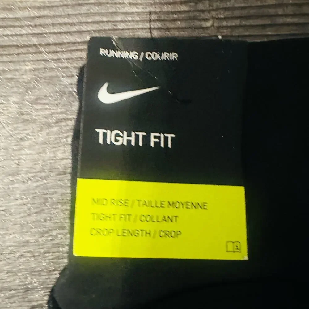 Nike Women's Black Solid Stretch Mid Rise Running Cropped Leggings Medium - Picture 4 of 5